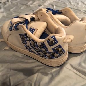 White and Royal blue Diesel Company (DC) shoes.